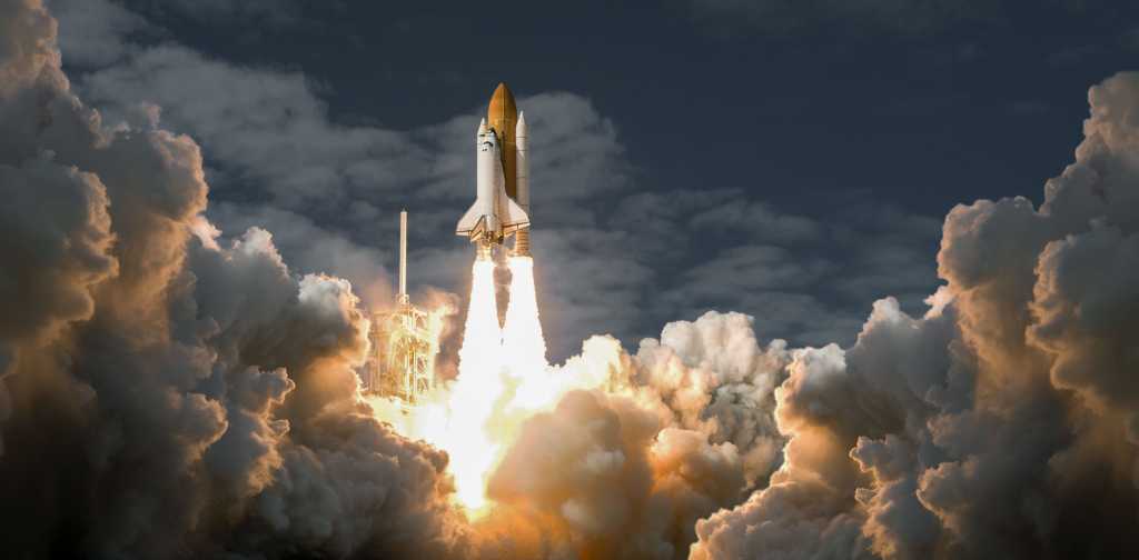 3803348-0-10092500-1738174559-shutterstock_1790620967-1 Spaceship, space age, liftoff: a space shuttle rises above the stratosphere.