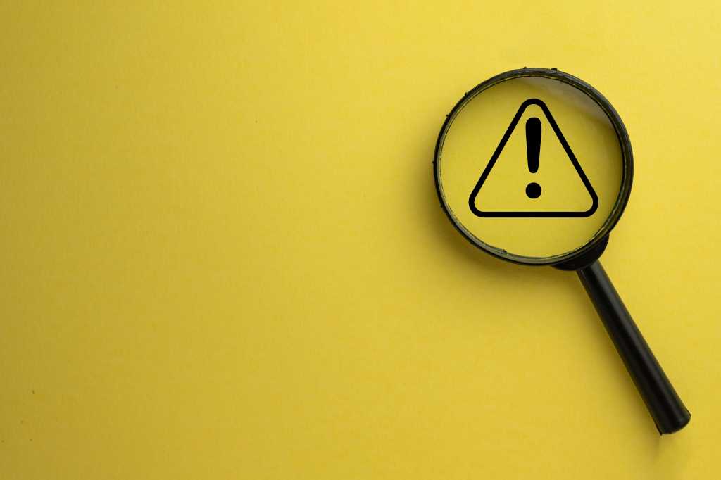 3951101-0-45836600-1743498129-shutterstock_2326291829-100963278-orig-1 Attention, warning sign; exclamation mark under a magnifying glass.