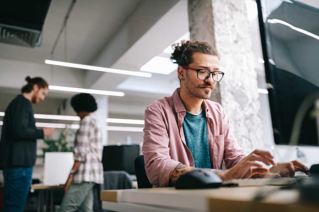 3964126-0-01946600-1744843920-shutterstock_1823014802-1 Programmer working and developing software in office