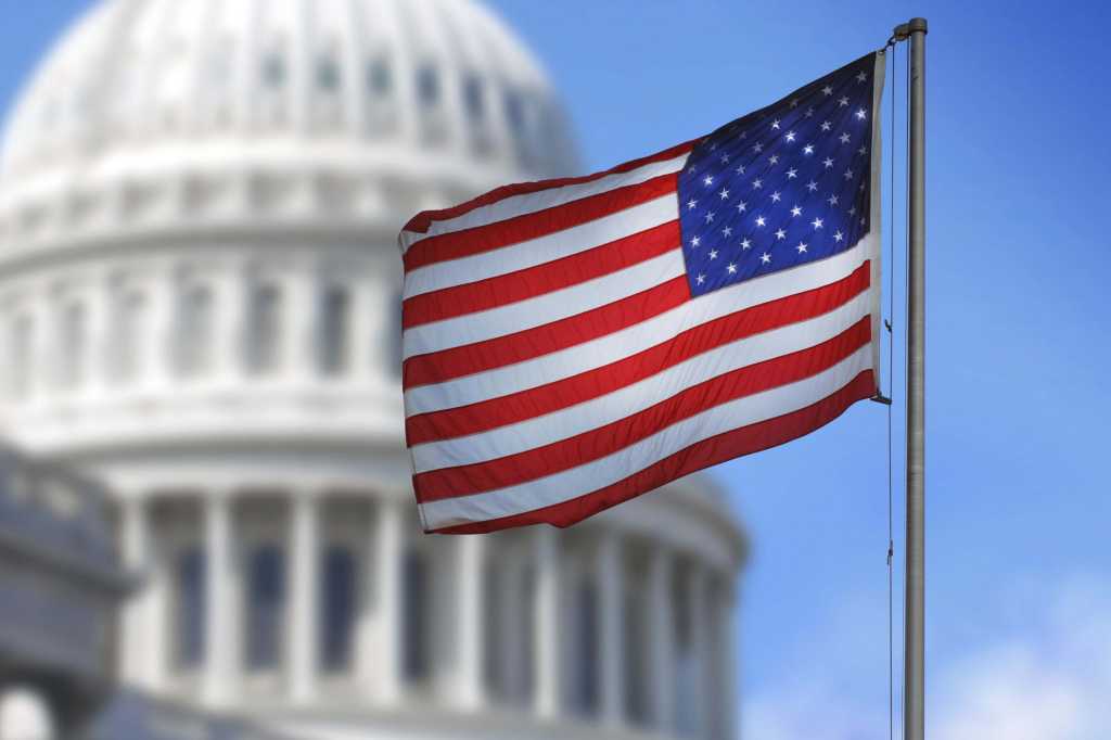 3964938-0-40766400-1744991999-thinkstockphotos-455634241-100610445-orig-100935300-orig-1 US flag in front of government state capital