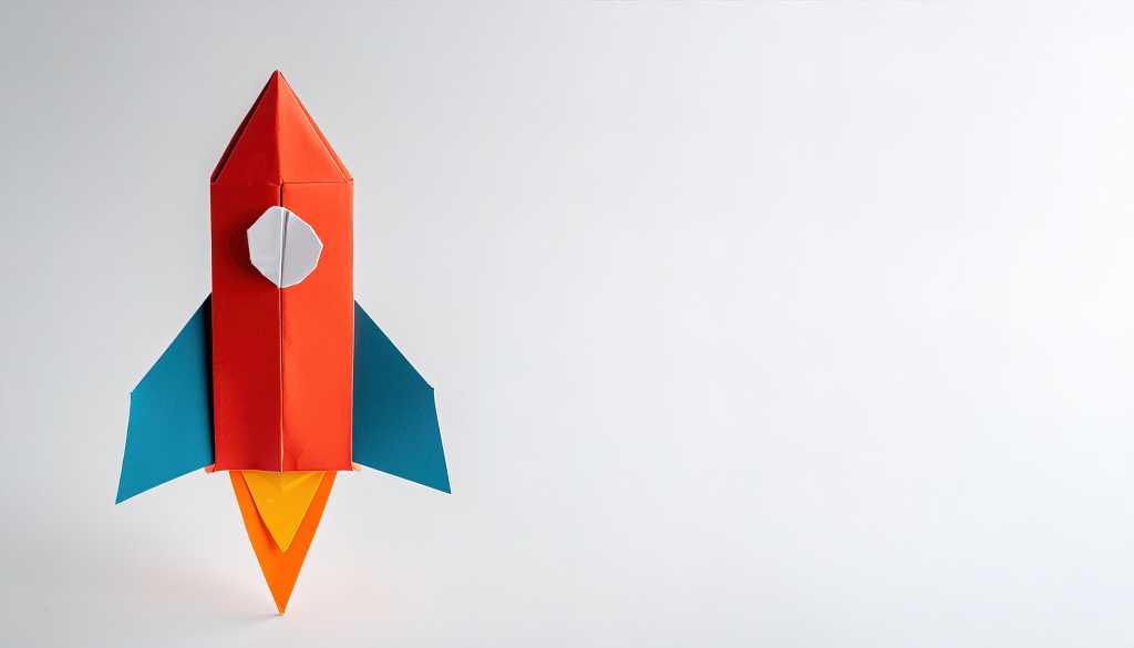 3965020-0-07647900-1744990861-shutterstock_2471633623-1 Ready for takeoff. A red and blue origami rocket ship poised for takeoff.