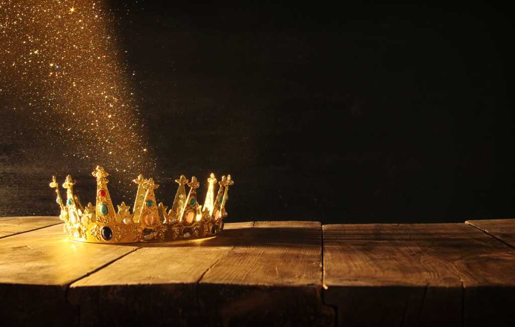 3982439-0-80434100-1747040474-shutterstock_701292883-100963044-orig-1 Crown, Royalty. Gold glitter streams from a royal crown.