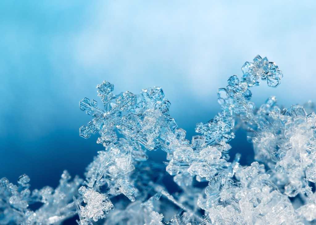 4000458-0-93980700-1749718894-shutterstock_757358335-100937194-orig-1 shutterstock 757358335 snowflakes on snow against clouds and blue sky natural snowflakes on snow