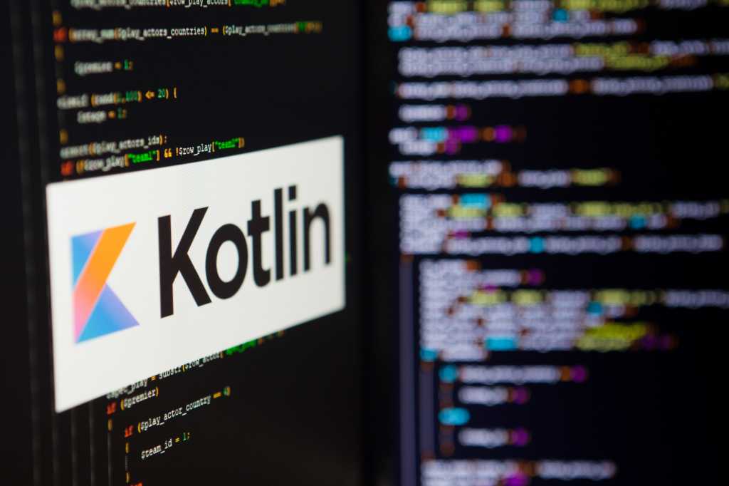 4001245-0-89761900-1748989607-shutterstock_1449950858-1 A computer screen shows the Kotlin logo against a backdrop of code.