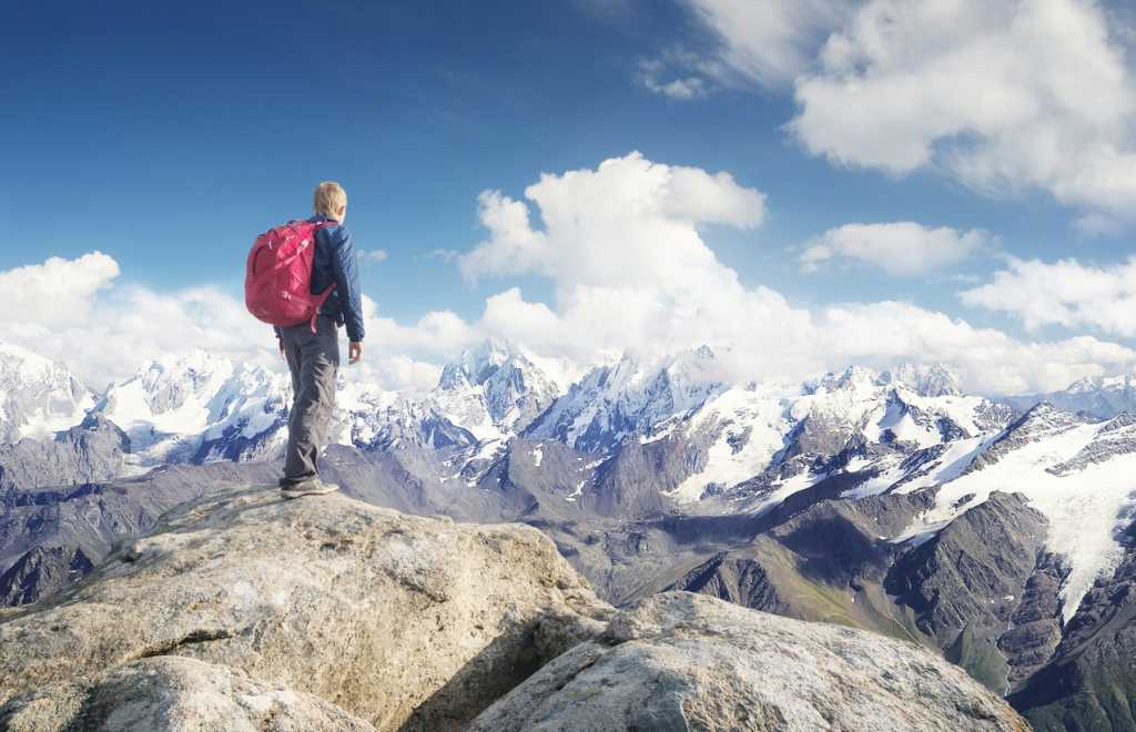 man top of mountain